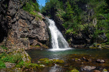 Fototapeta na wymiar Waterfall. Mountain waterfall. Mountain river.