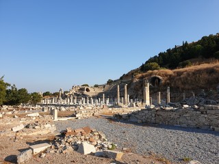 Fototapeta na wymiar The ruins of the ancient city of Ephesus on the background of Odeon Small Theatre 
