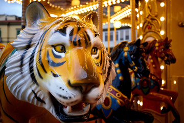 Fototapeta na wymiar Muzzle of attraction carousel tiger