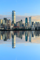 Fototapeta na wymiar Chongqing skyline and modern urban skyscrapers with water reflection at sunset,China.