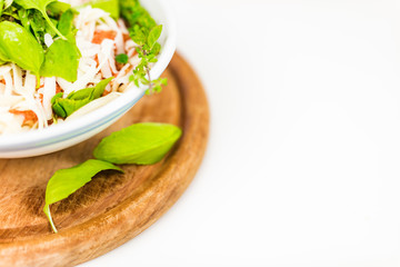 Italian pasta with tomato sauce, parmesan cheese, fresh oregano - on white background.