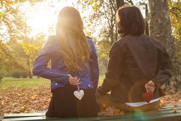 Couple in the park enjoying nice autumn time.