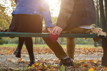 Couple in the park enjoying nice autumn time.