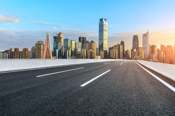 Asphalt highway passes through the city financial district in Chongqing at sunset,China.