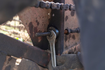 harvest. potatoes. breakdown of a retro tractor. turn the nut with a big wrench. pull the block