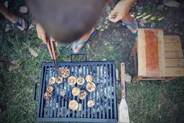 Barbecue making outdoors on a regular / vintage grill.