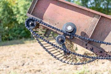 Fototapeta na wymiar harvesting potatoes. retro tractor. getting ready for the harvest. individual parts of the block.