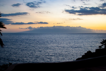 Island in the clouds at sunset in the middle of the Atlantic Ocean