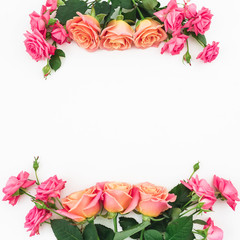 Copy space with bouquet of pink roses flowers on white background. Flat lay, top view