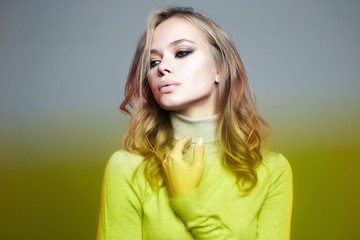 Fototapeta premium Beautiful woman in yellow color film. amazing curly girl