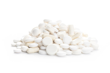 Obraz na płótnie Canvas Medical,pharmacy theme background concept. White pills on white background.