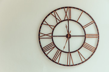 Old Clock made of wrought iron wall