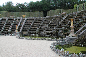 fountains in the gardens of the castle of versailles in france