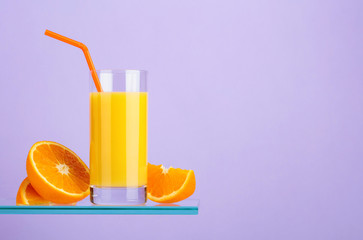 Glass of fresh orange juice with fresh fruits.