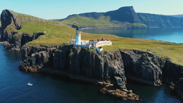 Scotland's Neist Point Lighthouse aerial drone orbit shot in 4K