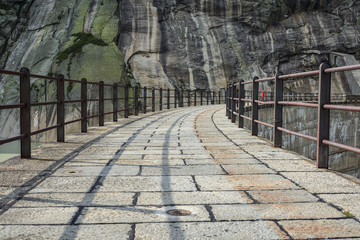 Path on top of Grimselsee dam close to Grimselpass in Switzerland