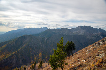  The mountain ranges of Satan and Hamar-Daban. Mountain peaks and valleys. Mountain landscape. The nature of Siberia.