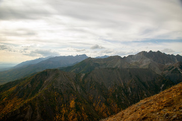  The mountain ranges of Satan and Hamar-Daban. Mountain peaks and valleys. Mountain landscape. The nature of Siberia.