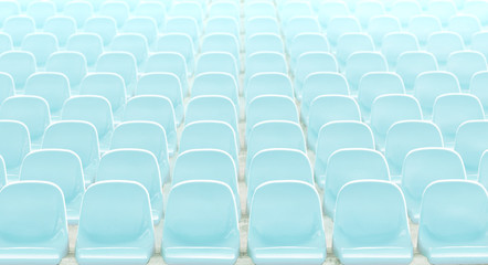 Light  blue rows of seats on the stadium .