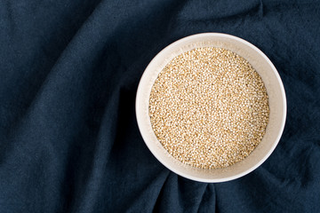 white bowl of uncooked quinoa