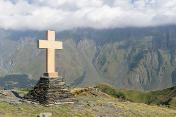 Georgia. Ancient Georgian Christian cross on top of a mountain. Georgian tourist attractions....