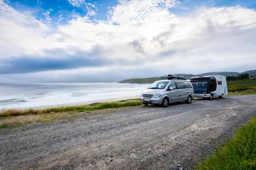 Fotobehang Motorhome RV and campervan are parked on a beach. © _jure