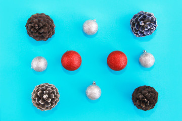 Christmas multi-colored toys balls and cones on the tree for the New Year holiday