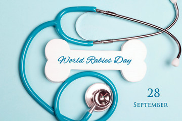 World Rabies Day background with stethoscope and symbolic bone.