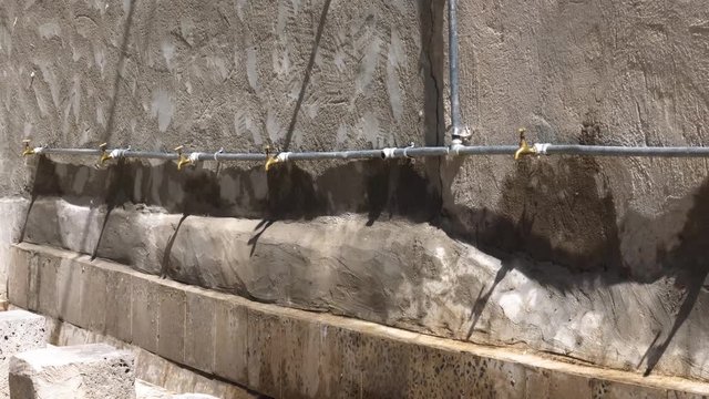 water is wasted in this area because someone break the sink in the mosque, Bait Alaya village, Ibb, Yemen.