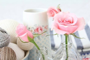 Yarn and pink roses