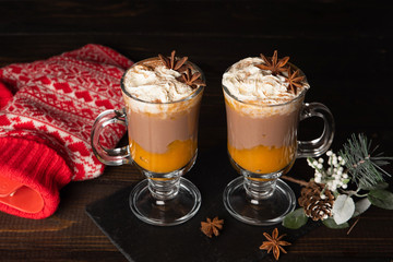 Pumpkin spice latte. Sweet chocolate hot drink with whipped cream