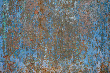 Old worn metal surface with paint. Rusty metal texture. Metal sheet with rust and worn paint. Background. Metal. Wall. Floor