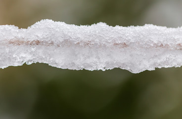 Snow on a clothesline as background