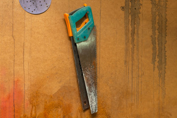 Two old handsaws hanging on a wall