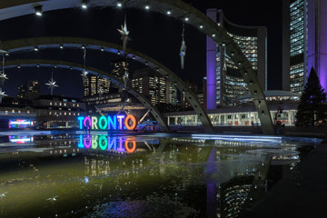 Night view of Nathan Phillips Square and Toronto Sign in downtown Toronto, Ontario., Canada