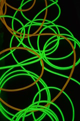 Bright luminous yellow and green, lime neon wires in different formats and layouts. An...