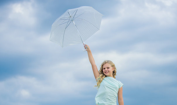Happy childrens day. Enjoying ease. Carefree child outdoors. Weather forecast. Ready for any weather. Weather changing. Fresh air. Girl with umbrella cloudy sky background. Freedom and freshness