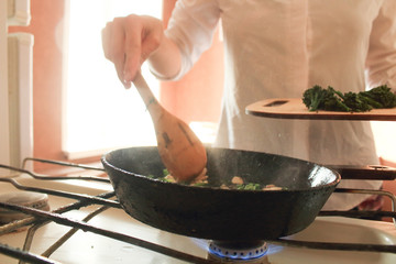 cook prepares eggs at home