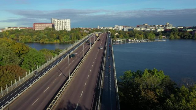 Aerial view of cyclists crossing bridge Vasterbron, Stockholm, Sweden.