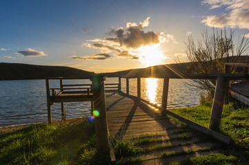 Beautiful sunset on the dock for fishing of the Selga de Ordas reservoir in Leon, Spain