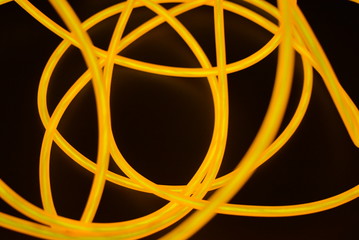 Bright orange luminous wire, twisted light wire, cable. Different shapes and images of...