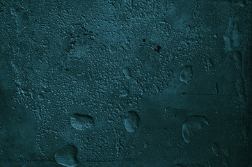 Urban concrete wall background with grooves and bubbles. Cement gray wall. Urban and industrialization art concept. Texture like concrete, stone, cement, plaster.. Poster mockup. Сloseup studio shot.