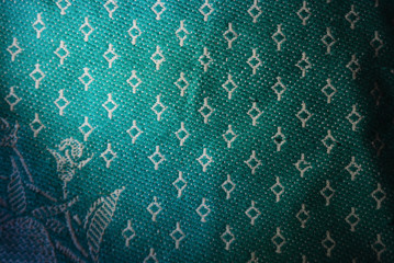 A dense green veil of large threads and different shapes, patterns and color patterns with...