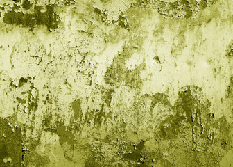 Grungy rusted metal surface in yellow tone.
