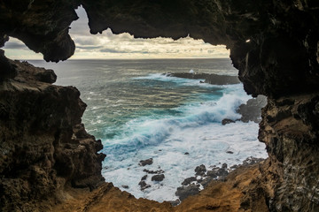 Hole to the pacific ocean inside lava cave, Easter Island