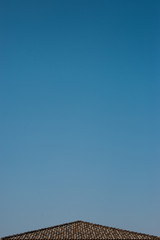 The roof of the house against the sky