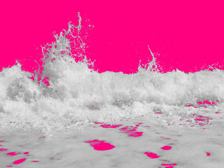 white sea foam from the surf, isolated on a bright pink background