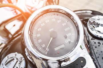 Black motorcycle speedometer with chrome ring - Powered by Adobe