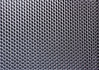 Black mesh metallic fiber texture close-up. Diamond aluminum iron patterrn.