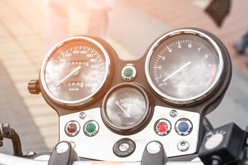Black motorcycle speedometer with chrome ring